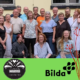 Bilete av koret Blåne, ein felespelar og logo for kursgården og Folkmusikens hus.